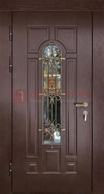 Темная железная дверь со стеклом и ковкой для частного дома ДСК-156 В Ижевске