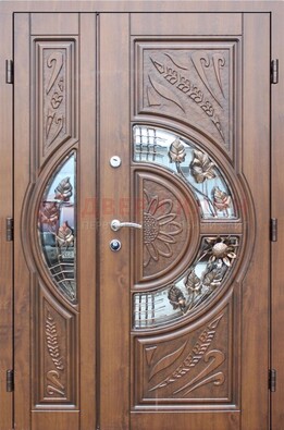 Уличная дверь в цвете Итальянский орех с виноритом и ковкой со стеклом ДВТ-147